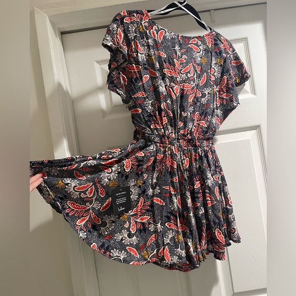 Adorable Dondi Navy Blue Print Romper perfect for your next vacation or summer - Picture 3 of 5